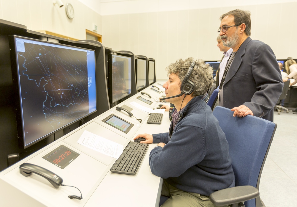 Sofia, Bulgaria - December 2, 2014: Air Traffic Controllers at the "Bulgarian Air Traffic Services Authority" (BULATSA) control center are operating on their work places.